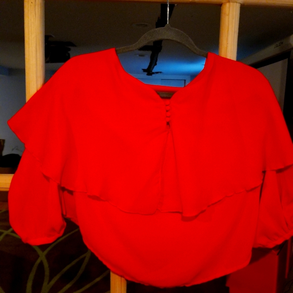 Red top with 3/4 sleeves - perfect for a night on the town or work